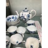 MEISSEN BLUE AND WHITE ONION PATTERN: EIGHT SAUCERS, SIX SHAPED CUPS, FOUR TEAPLATES, TEAPOT AND ONE