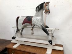 A SADDLED GREY ROCKING HORSE WITH BLACK DETAILS, HAIR MANE AND TAIL. W 153 x H 113cms.