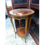 A FRENCH ROSEWOOD AND BRASS MOUNTED TWO TIER OCCASIONAL TABLE. H 74 X DIAMETER 47cms.