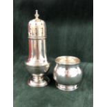 A SILVER SUGAR CASTER, BIRMINGHAM 1939, THE LID OF THE BALUSTER SHAPE PIERCED WITH STARS. H 17cms.