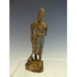 A BURMESE BRONZE FIGURE OF A MAN WITH A RUCKSACK ON HIS BACK AND HIS DOG ON A LEAD. H 14.5cms.