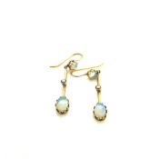 A PAIR OF EDWARDIAN OPAL AND SEED PEARL DROP EARRINGS STAMPED 9ct AND ASSESSED AS 9ct GOLD. DROP