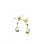 A PAIR OF EDWARDIAN OPAL AND SEED PEARL DROP EARRINGS STAMPED 9ct AND ASSESSED AS 9ct GOLD. DROP