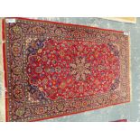 A PERSIAN KASHAN RUG. 216 x 142cms