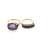 TWO AMETHYST DRESS RINGS. A FIVE STONE CARVED HALF HOOP RING, FINGER SIZE R 1/2, AND A SINGLE OVAL