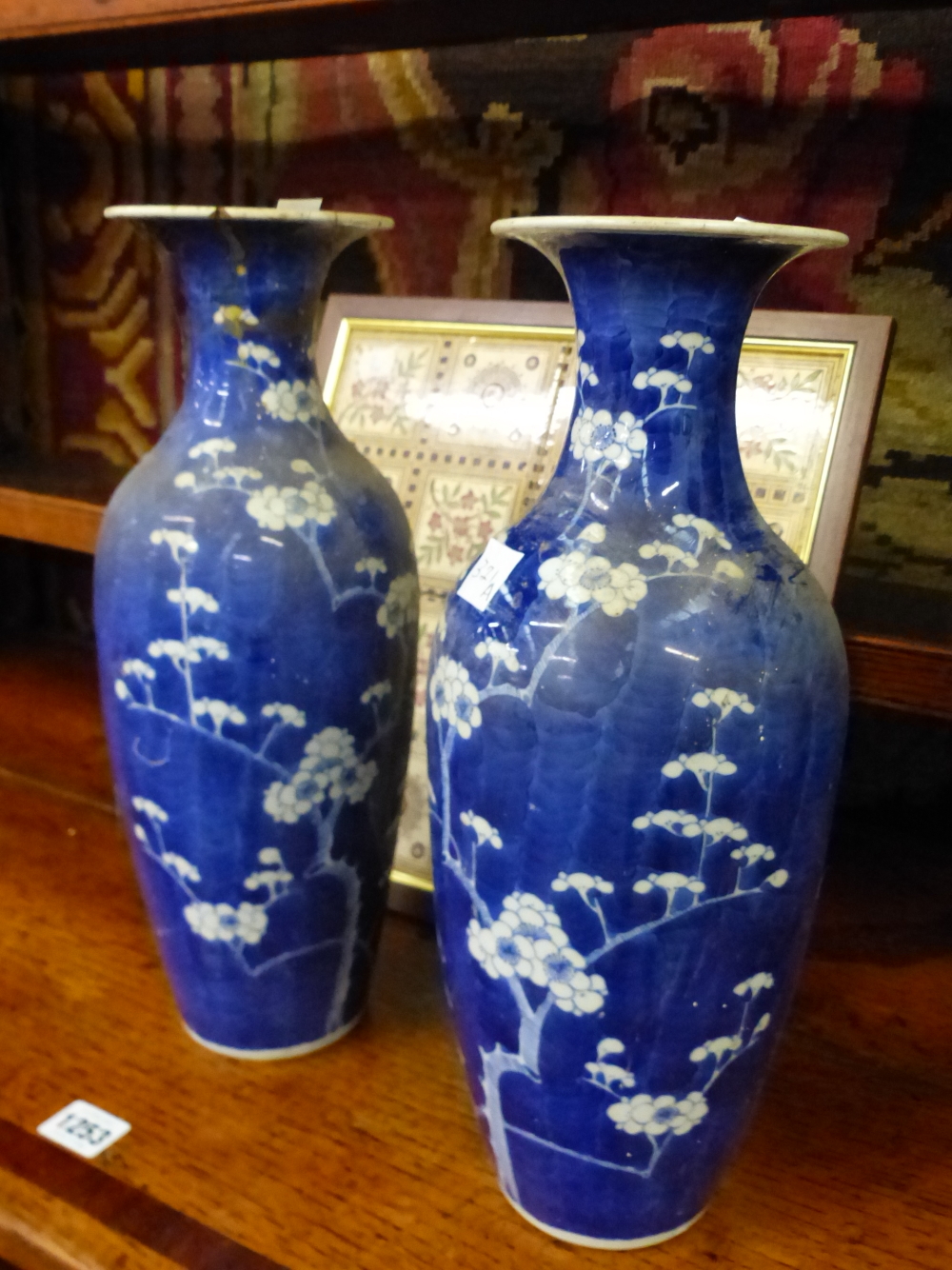 A PAIR OF JAPANESE BLUE AND WHITE BALUSTER VASES, EACH PAINTED WITH TWO RESERVES OF THREE FIGURES ON - Image 2 of 2