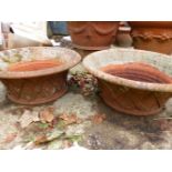 A NEAR PAIR OF SHALLOW TERRACOTTA PLANTERS WITH LATTICE DECORATION DIAMETER 56cm AND 52 cms