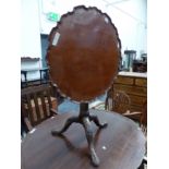 A GEORGIAN AND LATER MAHOGANY CARVED BIRD CAGE TILT TOP TRIPOD TABLE. H 71 X DIAMETER 73cms.