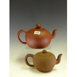 A CHINESE YIXING RED WARE TEA POT BEARING SEAL MARKS INSIDE THE COVER AND ON THE FOOT. Dia 15cms.