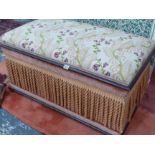 A VICTORIAN UPHOLSTERED BOX OTTOMAN.