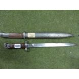 A THIRD REICH MODEL 1884/98 MAUSER BAYONET, CONTAINED IN ITS STEEL SCABBARD, TOGETHER WITH AN