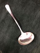 A SILVER OLYMPIA PATTERN SOUP LADLE BY MOSLEY & Co., SHEFFIELD 1942, 260Gms.