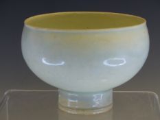 A QINGBAI ROUND SIDED BOWL RAISED ON A CYLINDRICAL FOOT. Dia. 11cms. WITH A CLOTH COVERED BOX