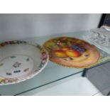 A ROYAL WORCESTER FRUIT DECORATED PLATE, A CONTINENTAL BASKET AND A GLASS CHEESE DISH