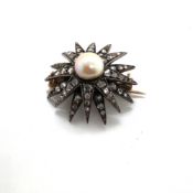 AN ANTIQUE DIAMOND AND CULTURED PEARL STAR BURST BROOCH. UNHALLMARKED, ASSESSED AS 9ct BACK WITH
