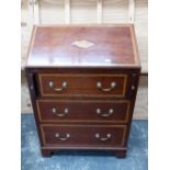 A 20th C. SATIN WOOD BANDED MAHOGANY BUREAU, THE CONCH INLAID FALL ABOVE THREE GRADED DRAWERS ON