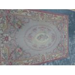 AN AUBUSSON DESIGN NEEDLEWORK RUG. 249 x 174cms