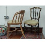 A VICTORIAN EBONISED AND GILT SALON SIDE CHAIR, TOGETHER WITH AN OAK SPINDLE BACK DESK CHAIR.