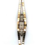 A VINTAGE ASPREY 17 JEWELLED DIAMOND SET LADIES WATCH ON A DOUBLE BRICK STYLE BRACELET STRAP.