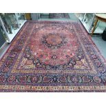 AN ANTIQUE PERSIAN CARPET OF CLASSICAL DESIGN 374 x 272 cm