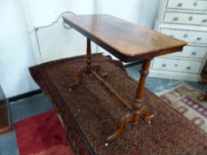 A VICTORIAN WALNUT SMALL CENTER TABLE RAISED ON TRESTLE BASE WITH CARVED LEGS