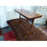 A VICTORIAN WALNUT SMALL CENTER TABLE RAISED ON TRESTLE BASE WITH CARVED LEGS