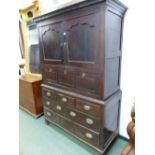 AN 18th/19th C. WELSH OAK CABINET WITH THE TWO DOORS TO THE TOP WITH SERPENTINE TOPPED PANELS OVER A