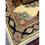 AN ORIENTAL CARPET OF PERISAN TABRIZ DESIGN. 350 x 248cms