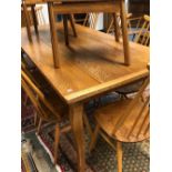 AN OAK FRENCH STYLE FARMHOUSE TABLE WITH CLEATED PLANK TOP