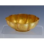 A CHINESE OCTAFOIL SILVER GILT BOWL, THE EXTERIOR WORKED WITH BIRD CENTRED PANELS, A ROUNDEL OF