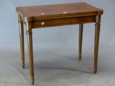 A GILLOWS BURR WALNUT GAMES TABLE, THE TOP MOUNTED WITH AN ORMOLU BEAD EDGE AND OPENING ON DRAW