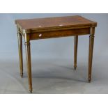 A GILLOWS BURR WALNUT GAMES TABLE, THE TOP MOUNTED WITH AN ORMOLU BEAD EDGE AND OPENING ON DRAW