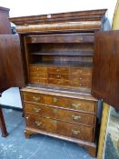 A GEORGIAN AND LATER WALNUT CABINET ON CHEST, AN OVOLU FRONTED DRAWER ABOVE THE DOORS TO THE TOP, TH