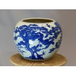 A CHINESE BLUE AND WHITE PLANTER, THE COMPRESSED SPHERICAL SIDES PAINTED WITH CRANES AND OTHER BIRDS