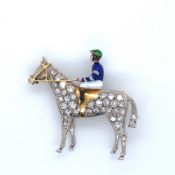 A VINTAGE 18ct HALLMARKED GOLD DIAMOND AND ENAMEL HORSE AND JOCKEY BROOCH. MEASUREMENTS 3 x 3cms.