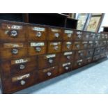 A VICTORIAN MAHOGANY APOTHECARYS CHEST OF TWELVE BANKS OF TWO DRAWERS OVER EIGHT BANKS OF TWO