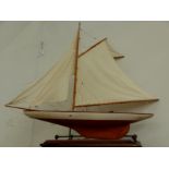 A 20th CENTURY GAFFRIGGED MODEL BOAT. OVER ALL LENGTH 110cms