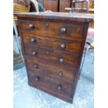 A 19th C. ROSEWOOD CHEST WITH ONE OF THE FIVE DRAWER FRONTS PAIRED TO MAKE ONE OF THE FOUR DRAWERS