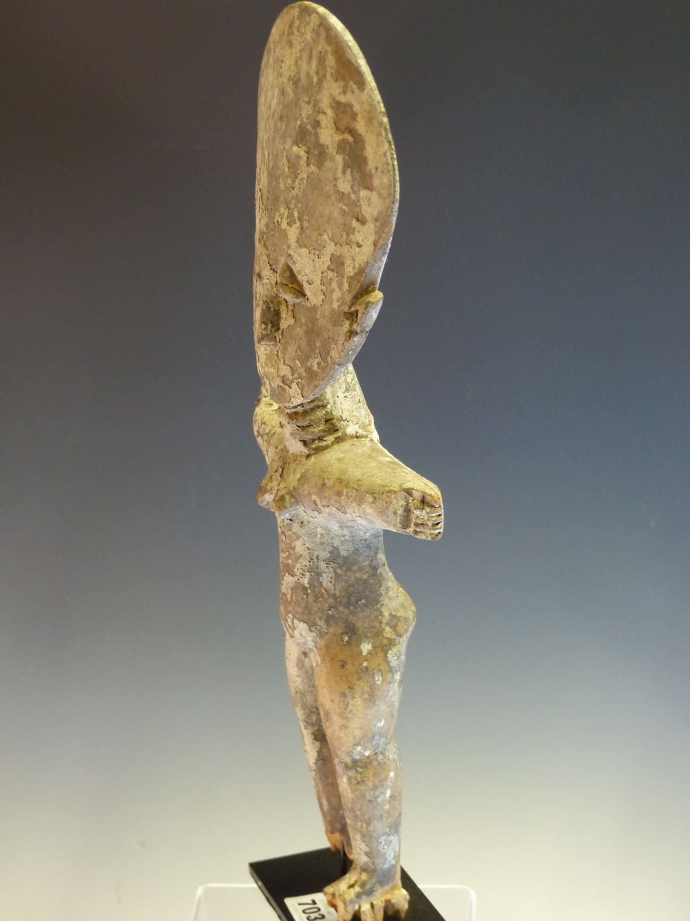 AN ASHANTI CARVED WOOD FERTILITY DOLL STANDING WITH ARMS OUT STRETCHED, THE SURFACE APPLIED WITH - Image 5 of 6