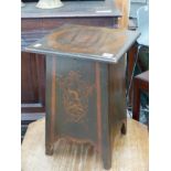 AN EDWARDIAN PEN WORK DECORATED LIFT TOP STOOL BOX.