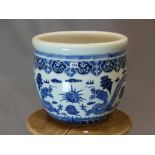 A CHINESE BLUE AND WHITE PLANTER, THE EXTERIOR PAINTED WITH TWO DRAGONS FACE TO FACE WITH A SACRED