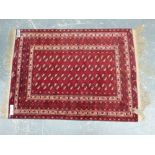 A GOOD QUALITY AFGHAN BOKHARA RUG. 182 x 133cms