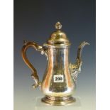 A GEORGE II SILVER COFFEE POT BY ?B, LONDON 1756, THE BALUSTER BODY ENGRAVED WITH A CREST ON ONE