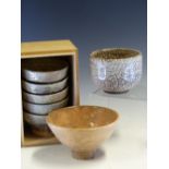 A BOXED SET OF FIVE JAPANESE RAKU BOWLS. Dia. 10.5cms. A PAIR OF BROWN RAKU BOWLS AND TWO OTHERS,