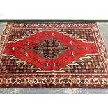 A PERSIAN TRIBAL RUG. 200 x 136cms