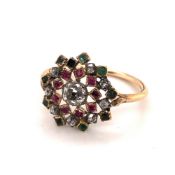 AN ANTIQUE OPEN WORK CLUSTER OLD CUT DIAMOND, RUBY AND EMERALD RING. UNHALLMARKED, ASSESSED AS