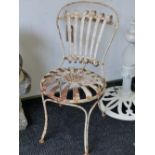 A PAIR OF FRENCH WHITE PAINTED IRON CAFE CHAIRS WITH SIX BAR HOOP BACKS AND ROUND SEATS WITH RADIATI