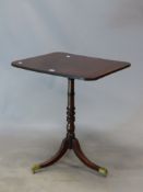 A 19th C. MAHOGANY TILT TOP TRIPOD TABLE, THE RECTANGULAR TOP ON RING TURNED COLUMN FLARING TO THE