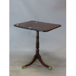 A 19th C. MAHOGANY TILT TOP TRIPOD TABLE, THE RECTANGULAR TOP ON RING TURNED COLUMN FLARING TO THE