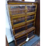 AN EARLY 20th CENTURY MAHOGANY FOUR TIER SECTIONAL BOOK CASE. H 141 X W 89 X D 31cms.